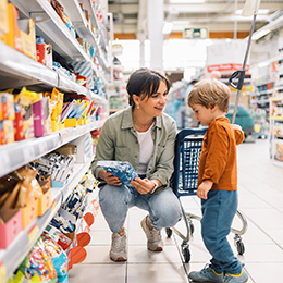Mother%20shopping%20with%20her%20young%20son%20in%20a%20grocery%20store%20aisle