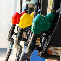 Close-up%20of%20a%20gas%20station%27s%20gasoline%20pumps%20and%20fuel%20nozzles%20