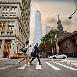 A%20man%20and%20woman%20walking%20on%20the%20pedestrain%20way.