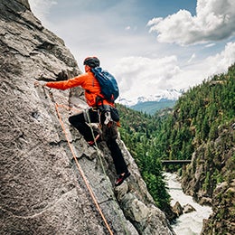 A%20rock%20climber%20leads%20up%20a%20rock%20face%20high%20above%20a%20mountain%27s%20river%20valley%20near%20Whistler,%20BC.