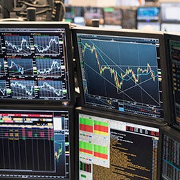 Stock%20market%20graphs%20on%20multiple%20computer%20screens%20on%20a%20trading%20floor.