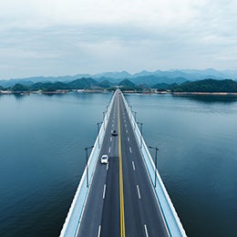 Aerial%20shot%20of%20a%20long%20bridge%20over%20a%20lake.