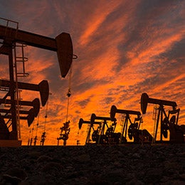 Pump%20jacks%20in%20an%20oil%20field%20during%20sunset.