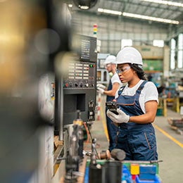 Female%20apprentice%20engineer%20working%20with%20CNC%20machine%20in%20factory