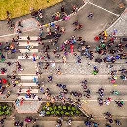 Aerial%20view%20of%20people%20on%20the%20street,%20with%20a%20street%20dividing%20into%20two.