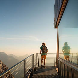 Man%20standing%20on%20a%20balcony%20in%20the%20mountains
