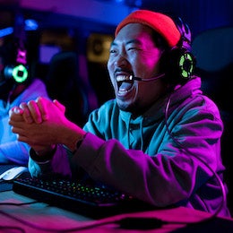 Man%20celebrates%20in%20front%20of%20a%20gaming%20computer,%20one%20of%20the%20technologies%20impacted%20by%20AI,%20which%20is%20reshaping%20companies%20within%20the%20underlying%20holdings%20of%20Invesco%20QQQ%20ETF.%20