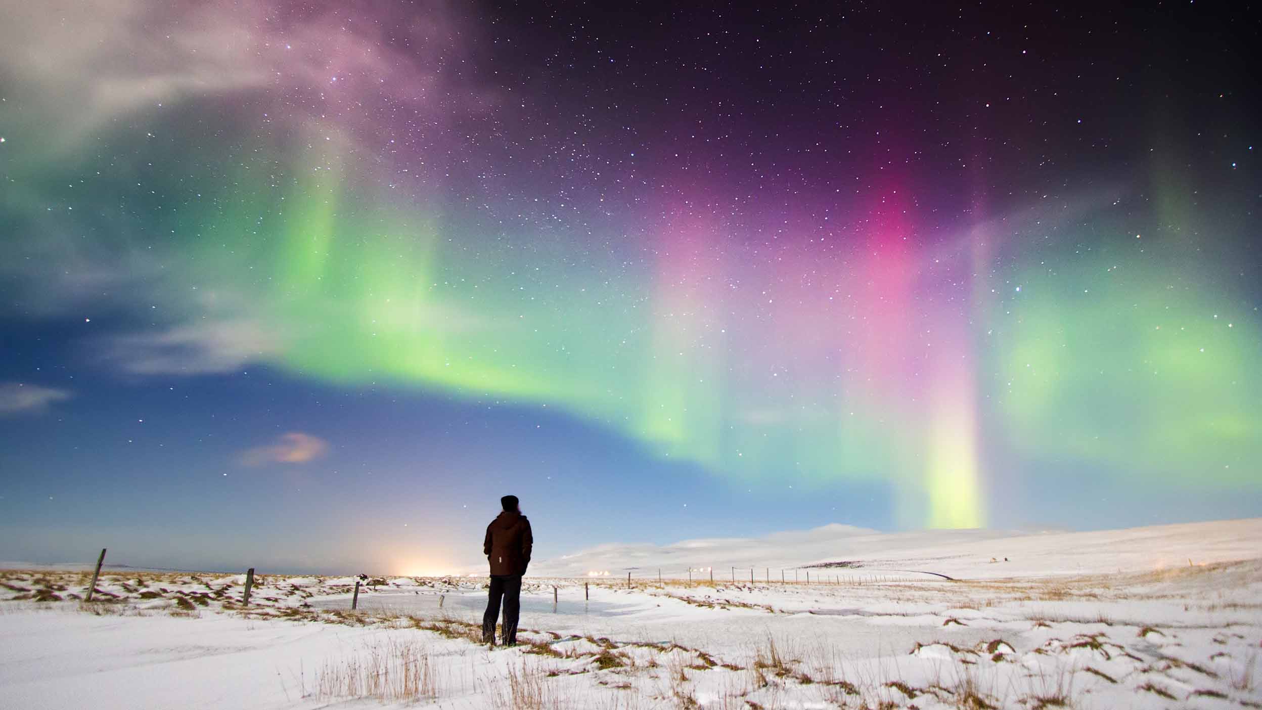 auroras in the calm night sky, representing the right time to use low volatility ETFs in your portfolio