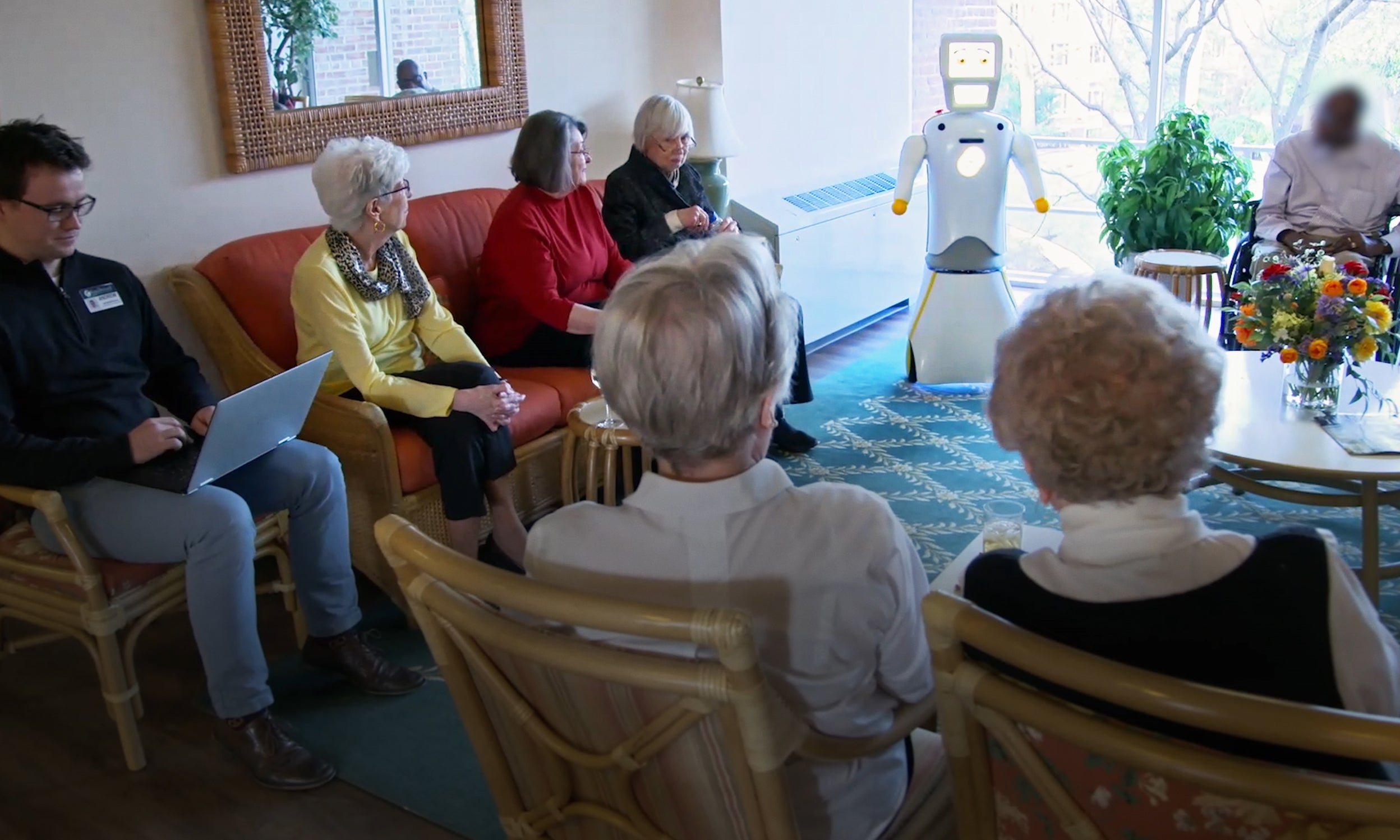Social robot Stevie assisting patients in a nursing home from Akara Robotics as featured in Invesco's Innovation Now series