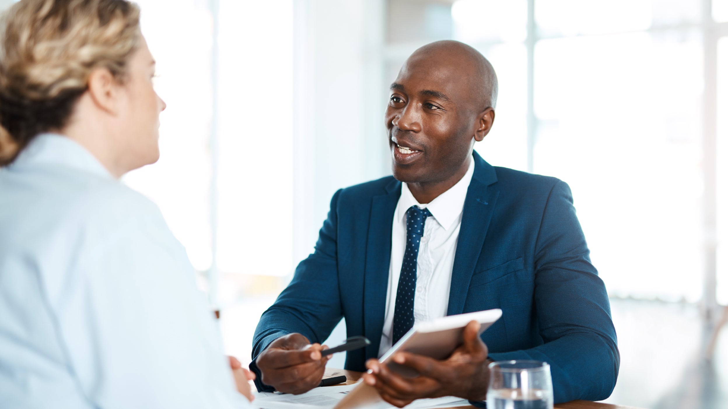 Shot of a young businessman and businesswoman having a discussion in a modern office