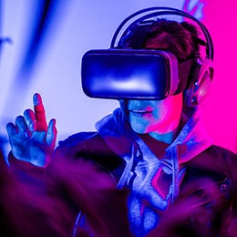 Woman%20interacting%20in%20virtual%20reality%20with%20VR%20glasses,%20enjoying%20the%20metaverse.