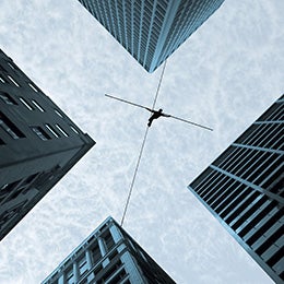 Person%20walking%20on%20a%20rope%20from%20one%20high-rise%20building%20to%20other