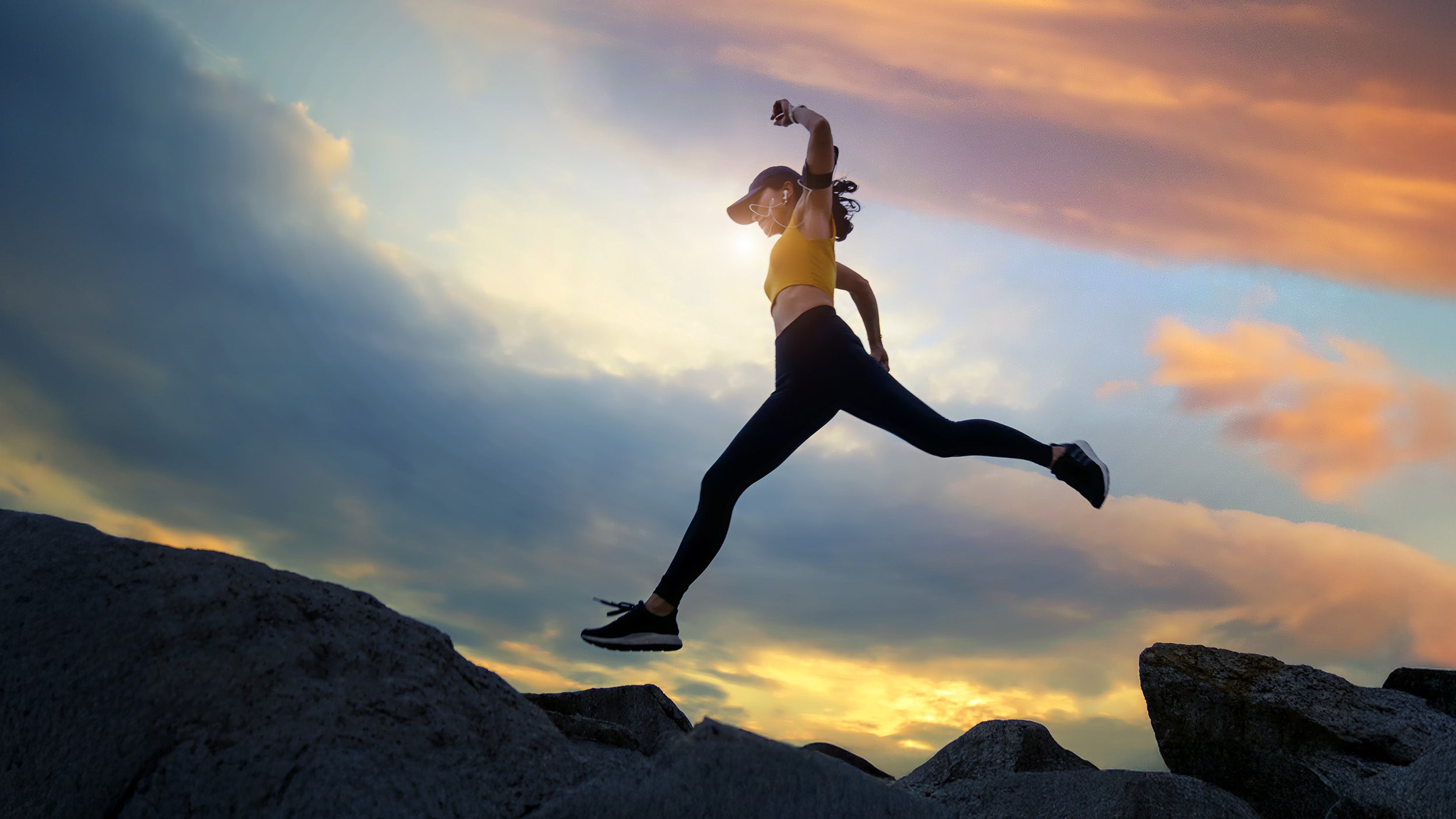 Runner jumping over a ledge