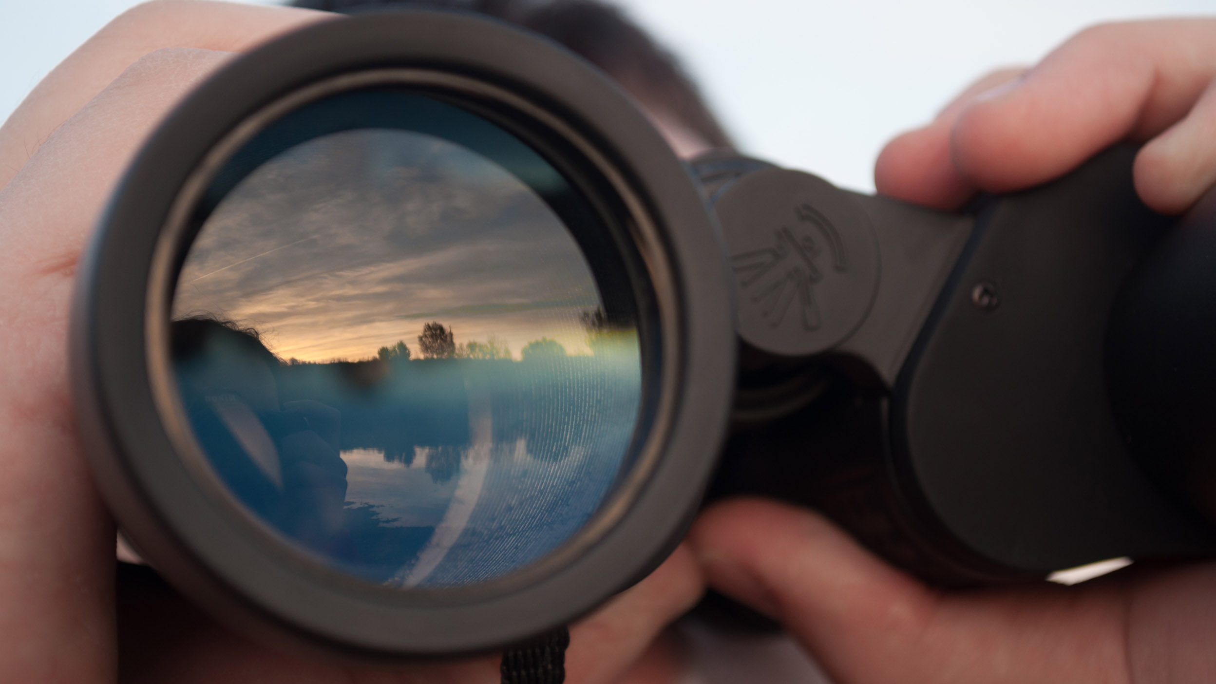 Man looking through binoculars