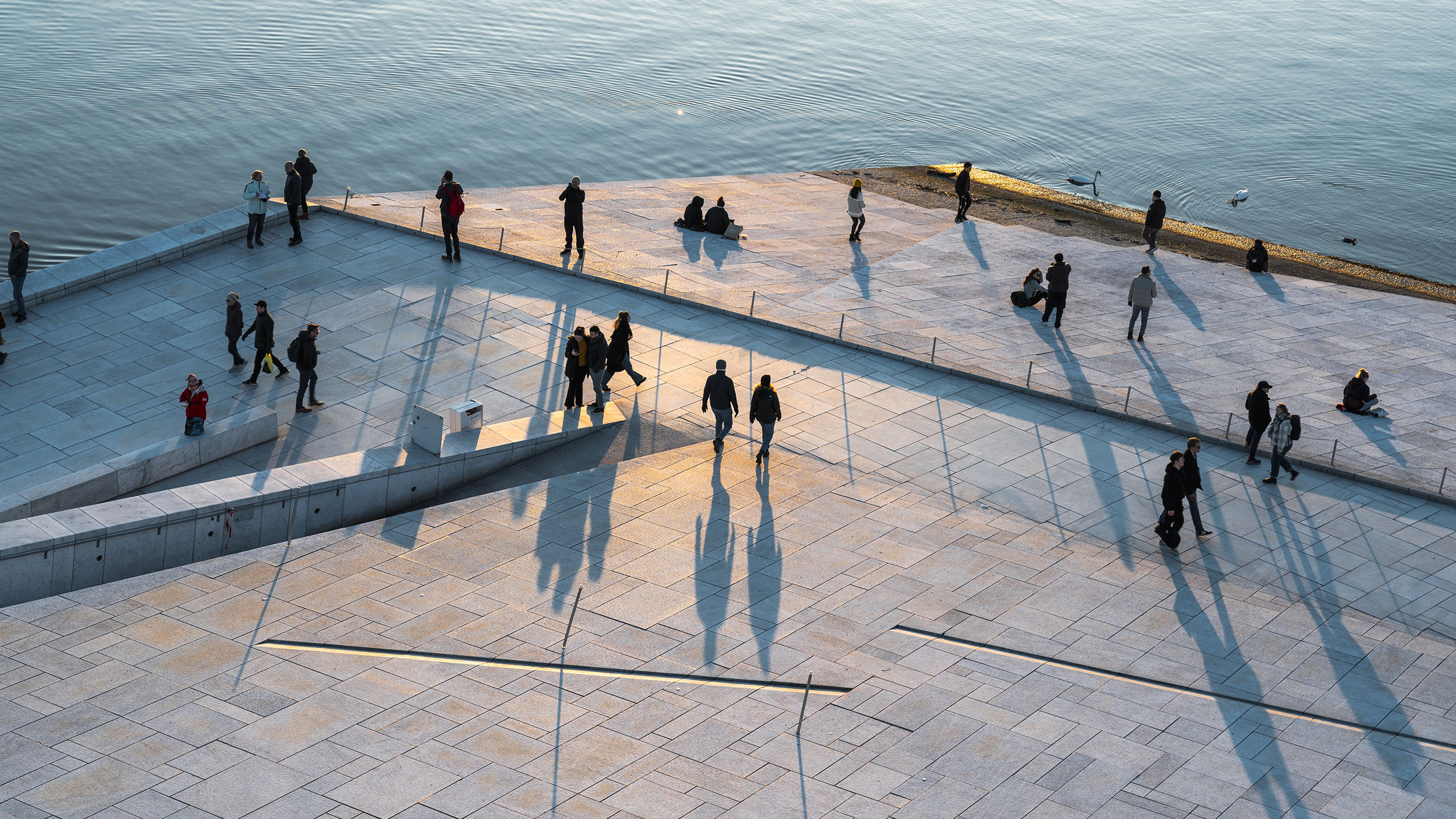 People walking along Oslo's harbour promenade, Oslo, Norway