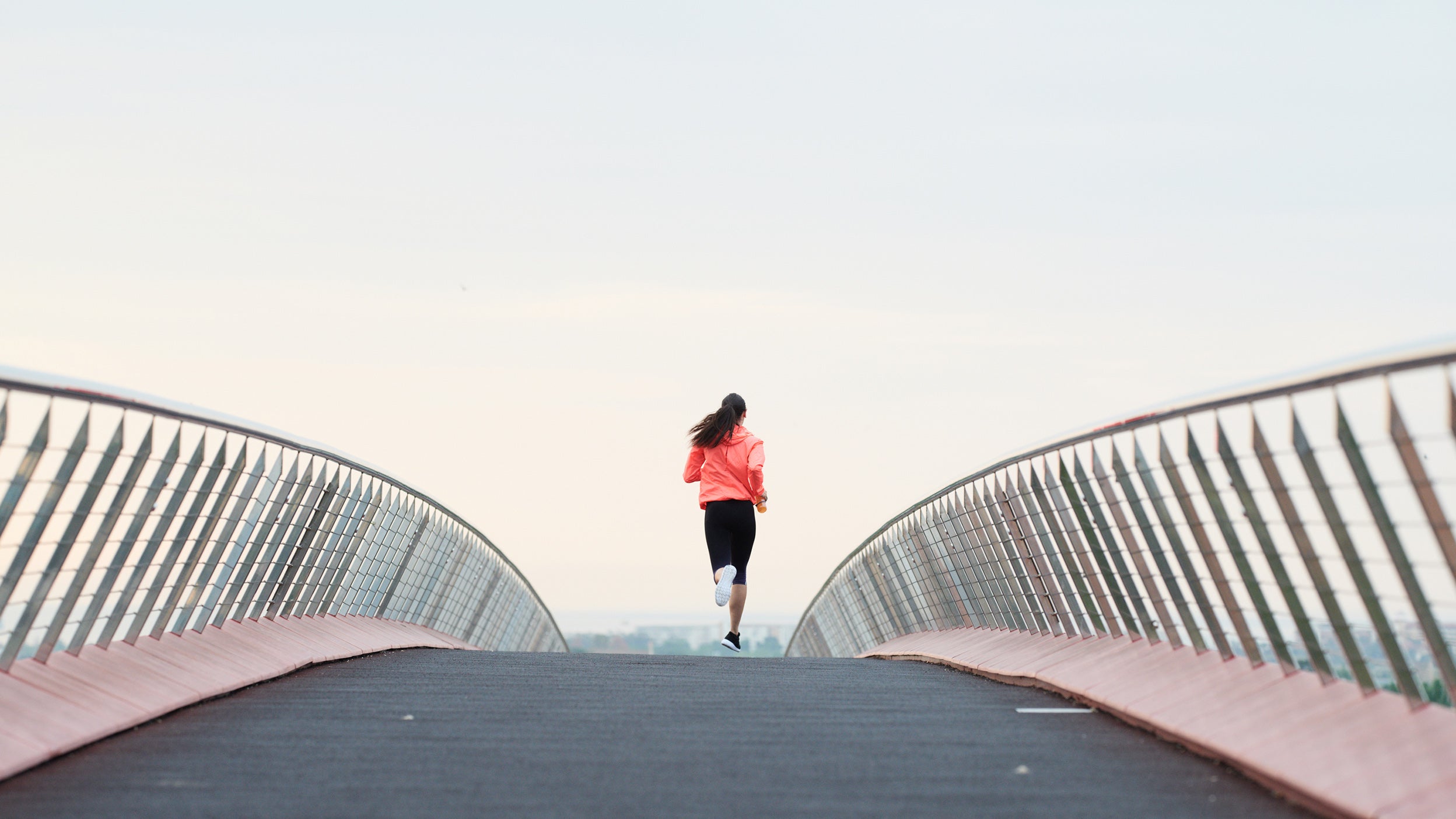 Woman running uphill.