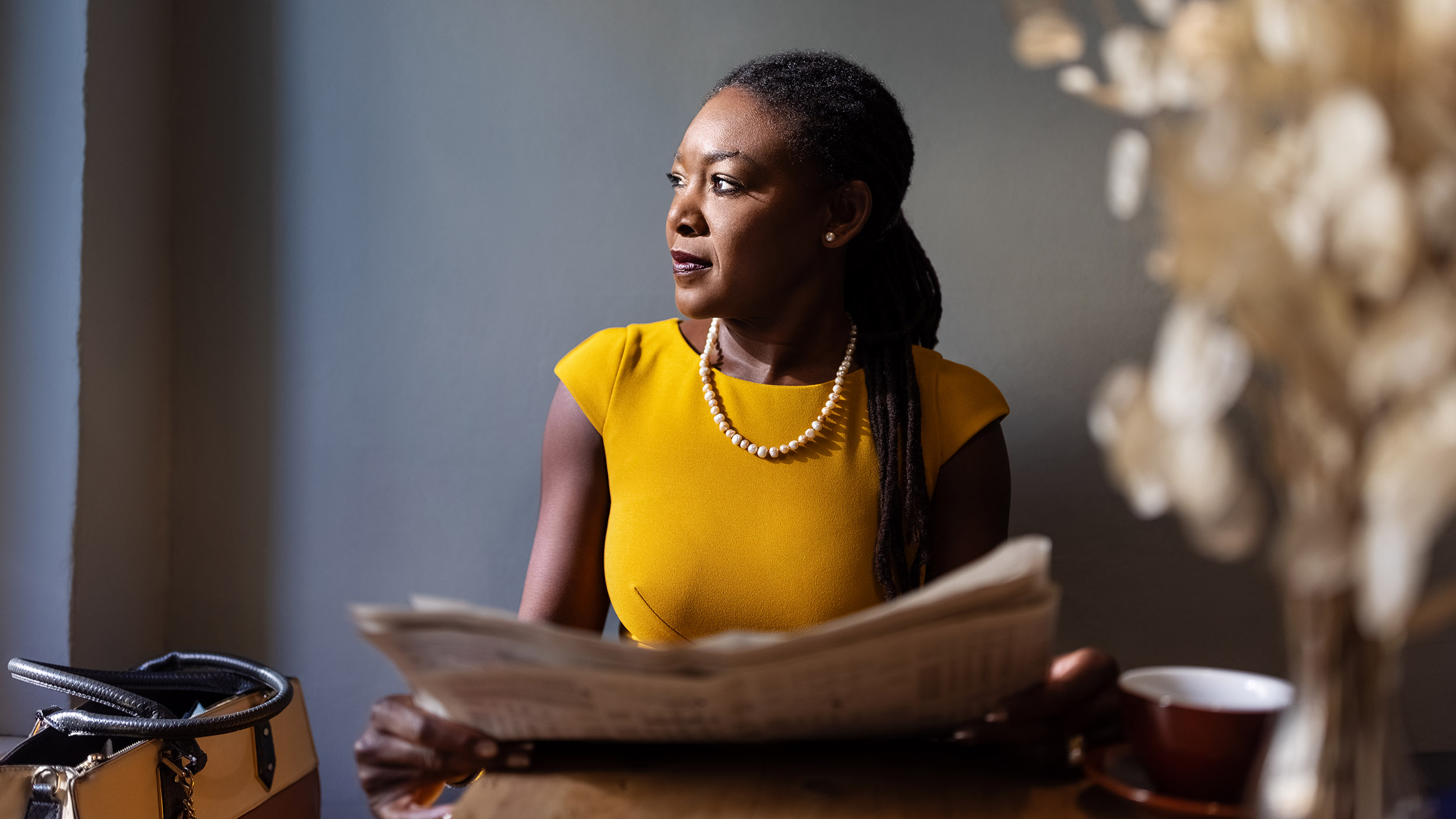 Woman holding a newspaper