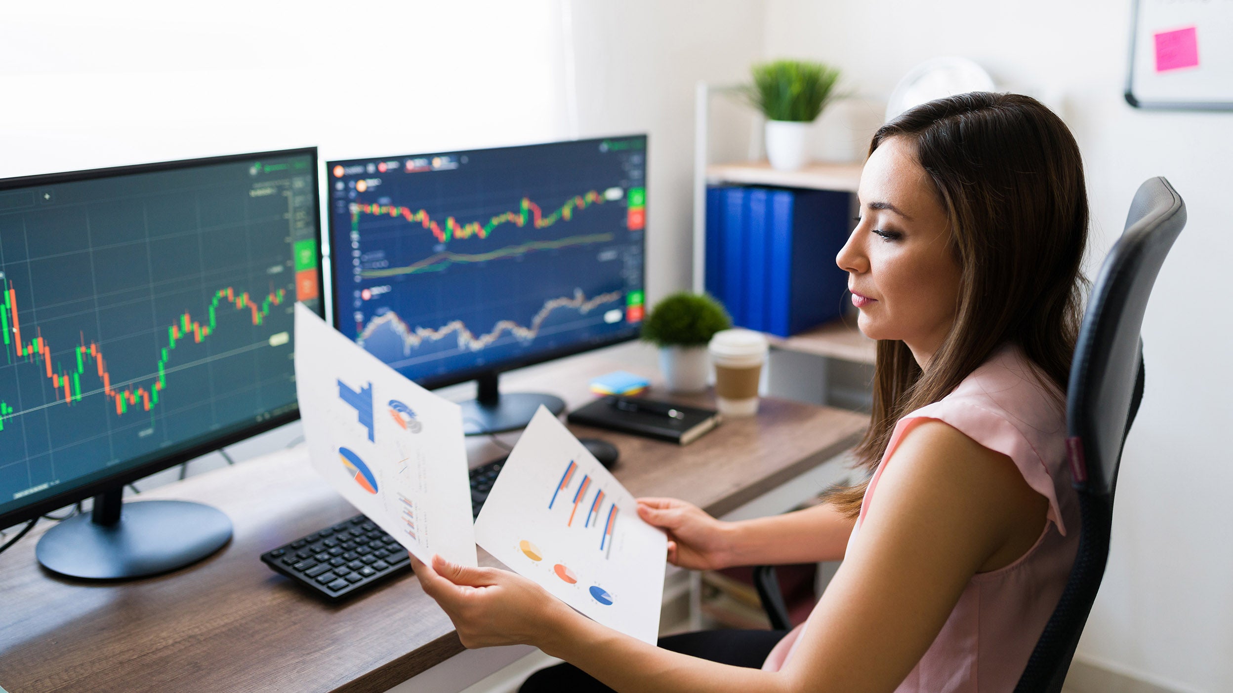 women checking the statistical data on paper