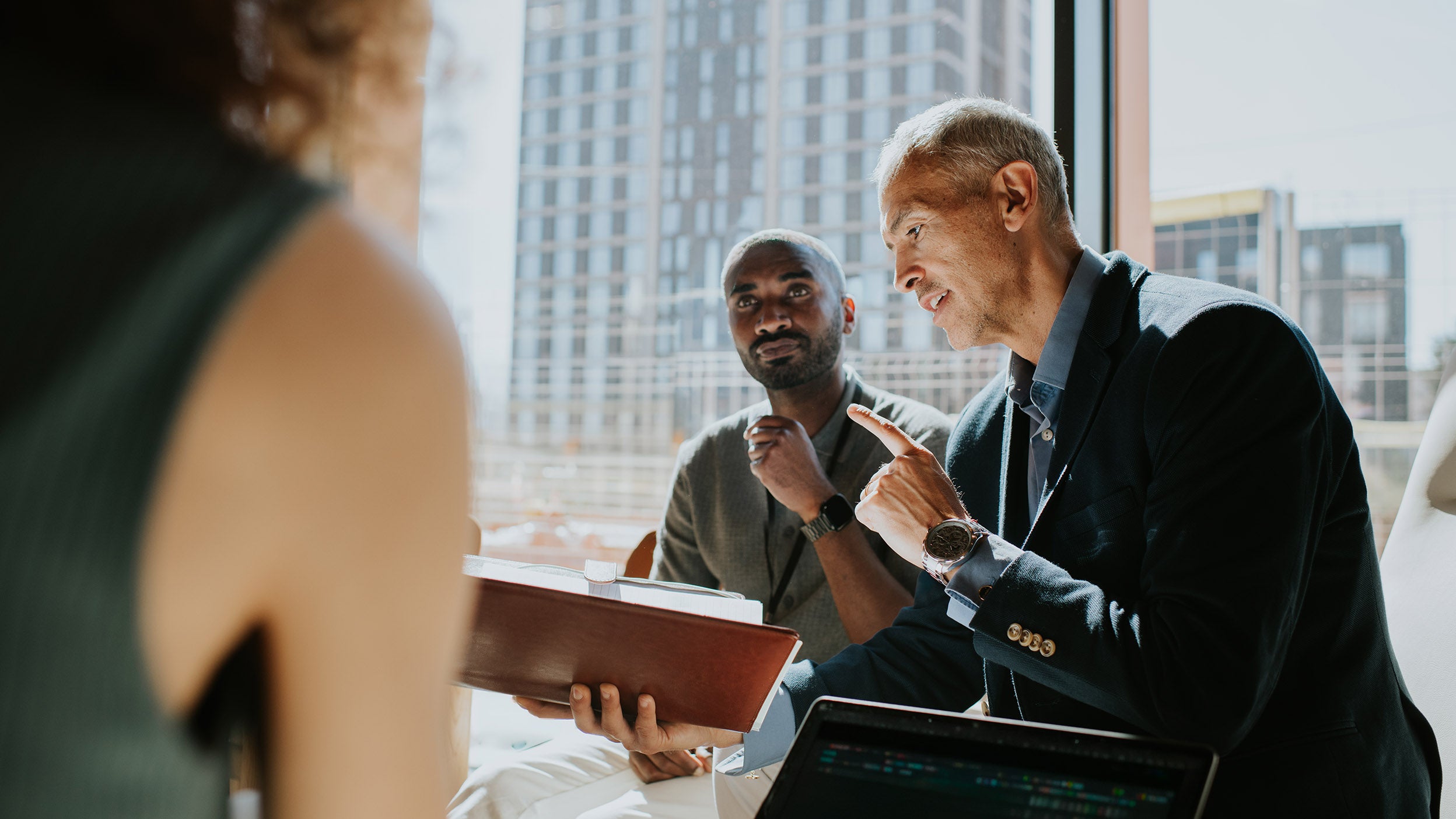 Group of people discussing in office