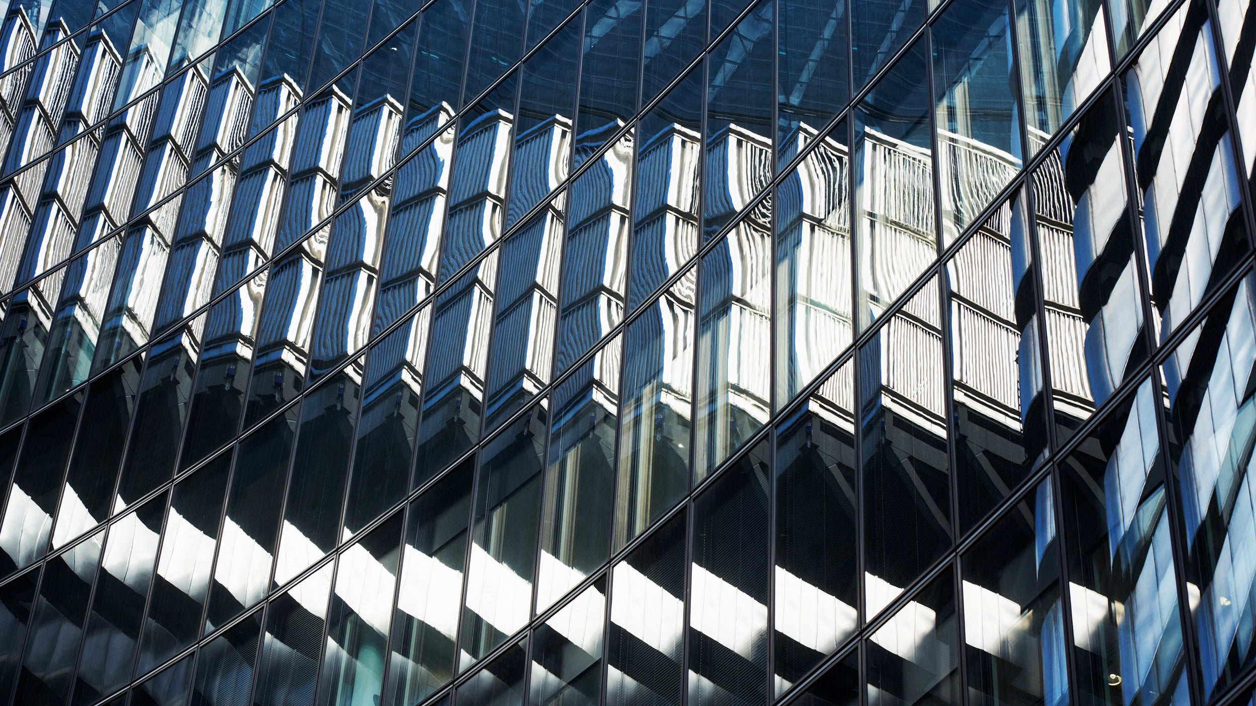 Building reflection in another building mirrors