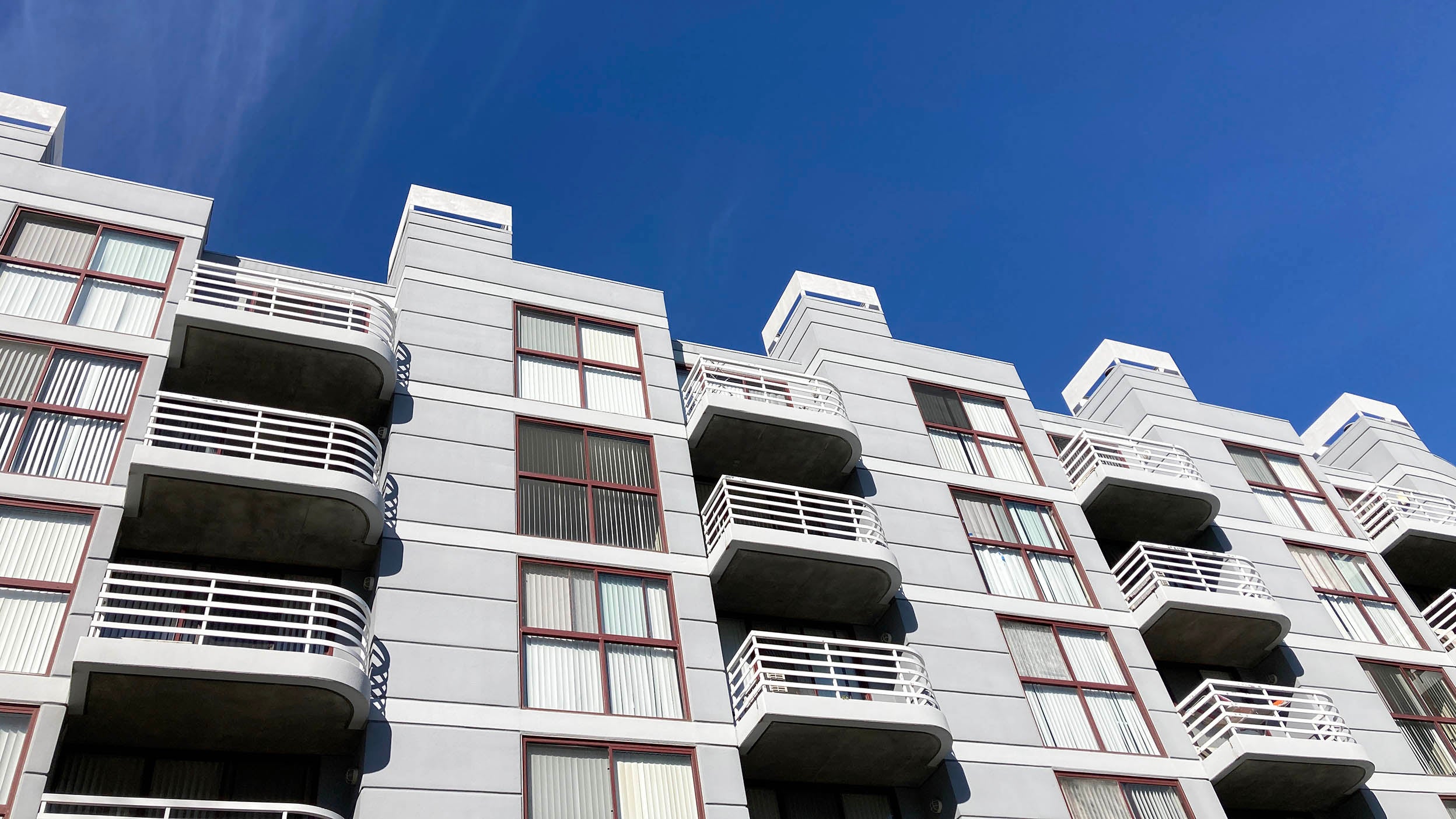 Exterior view of typical multifamily mid-rise residential apartment building