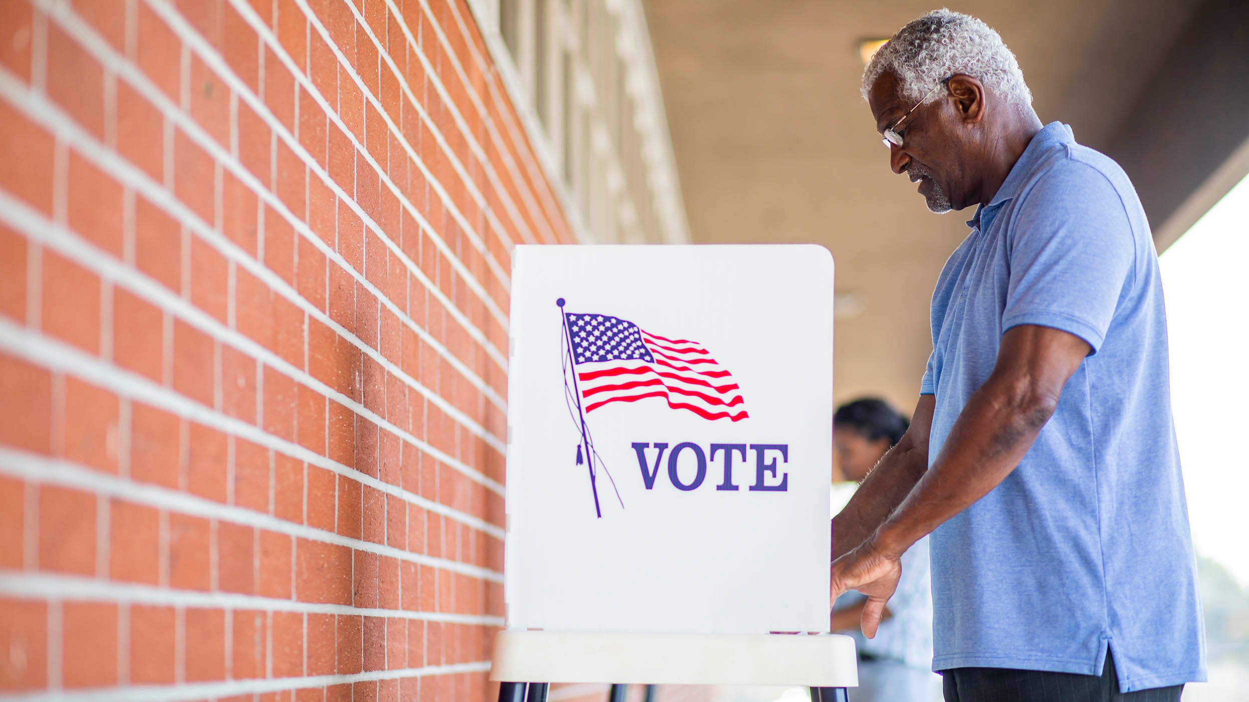 Voters voting in polling place