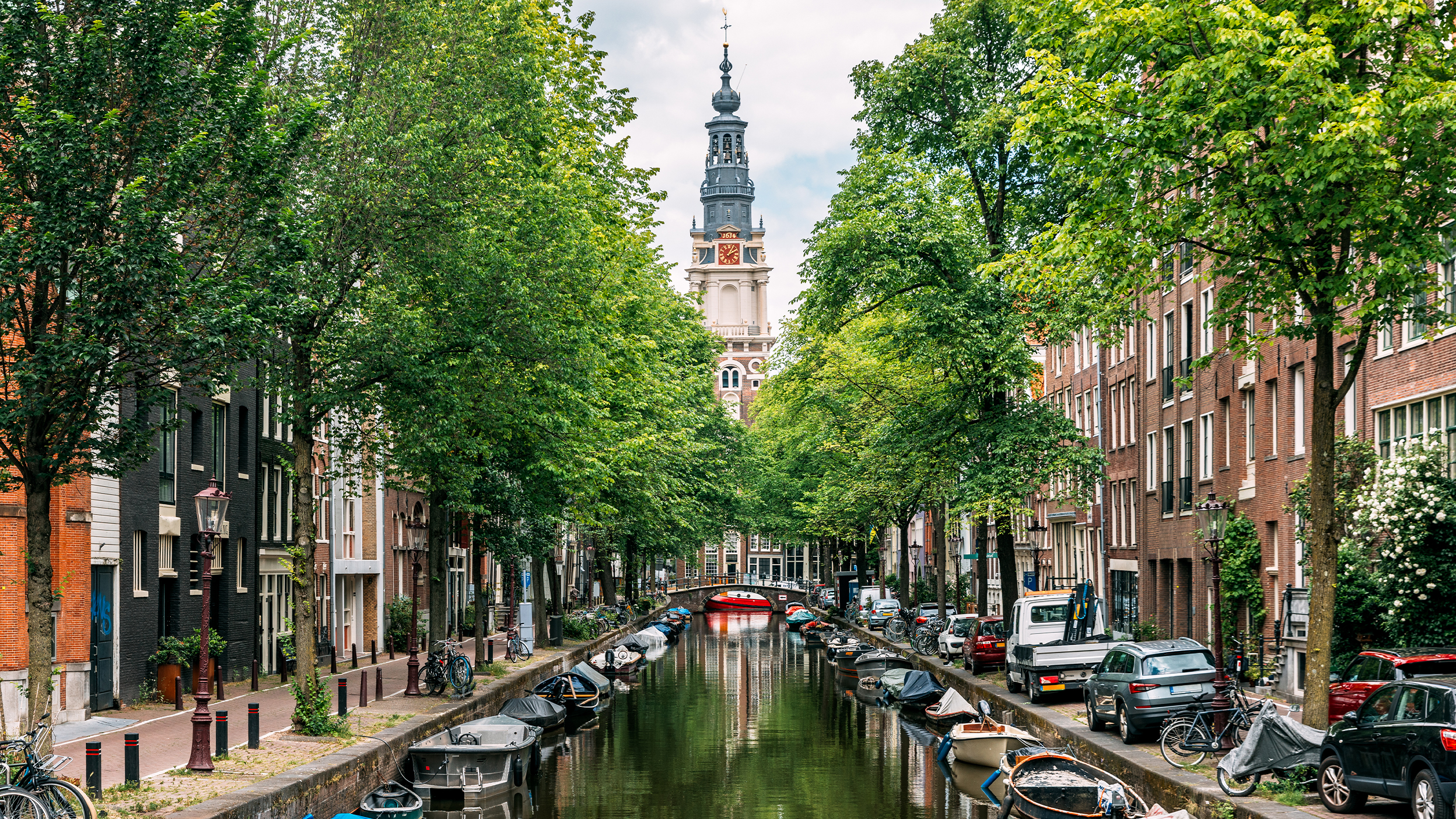  Zuiderkerk church and Groenburgwal canal in summer, Amsterdam, Netherlands