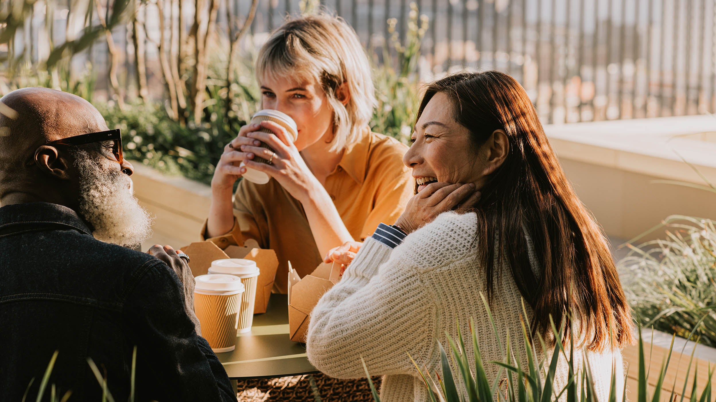 Three people having a conversation