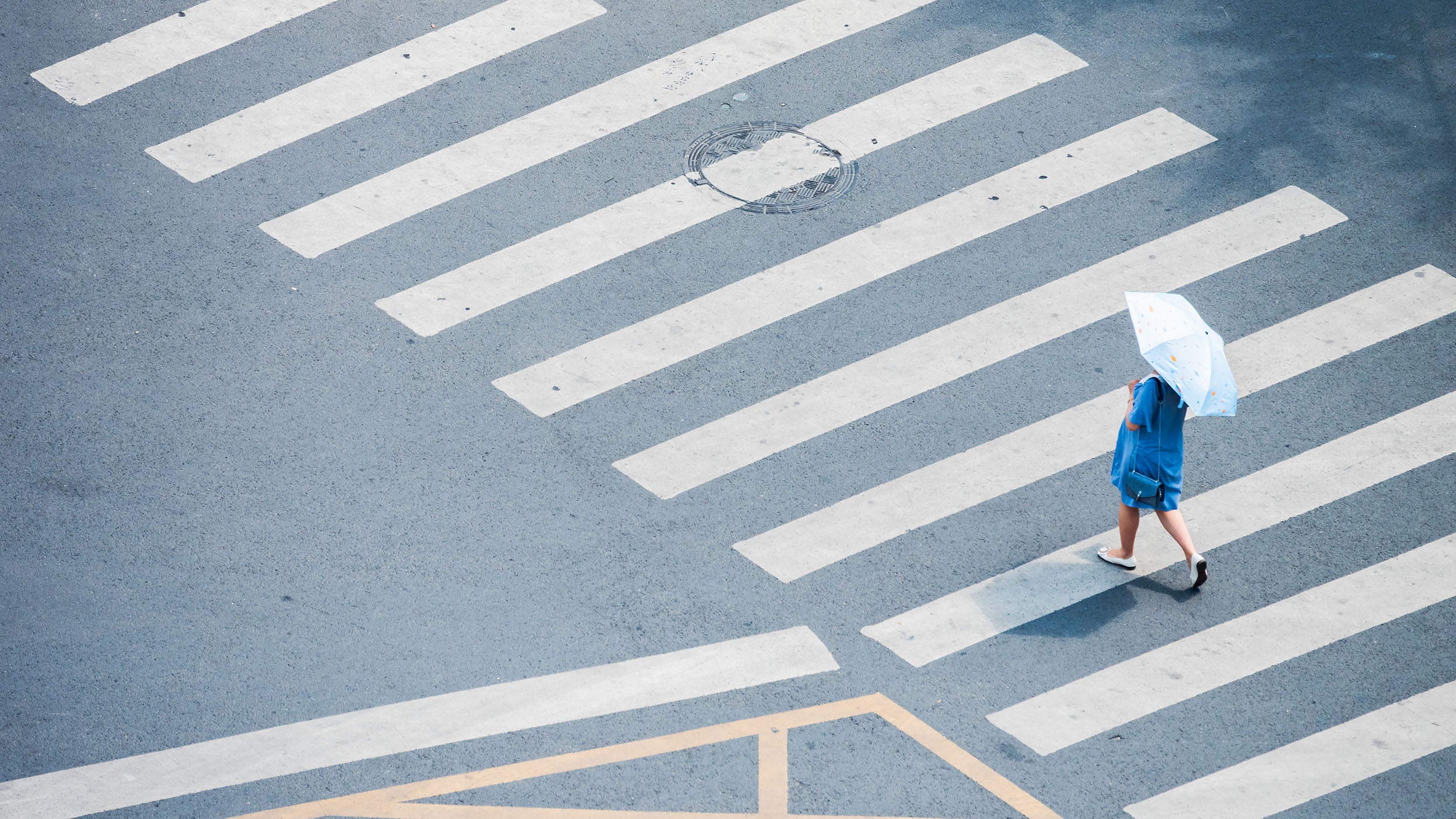 Women crossing road on zebra crossing