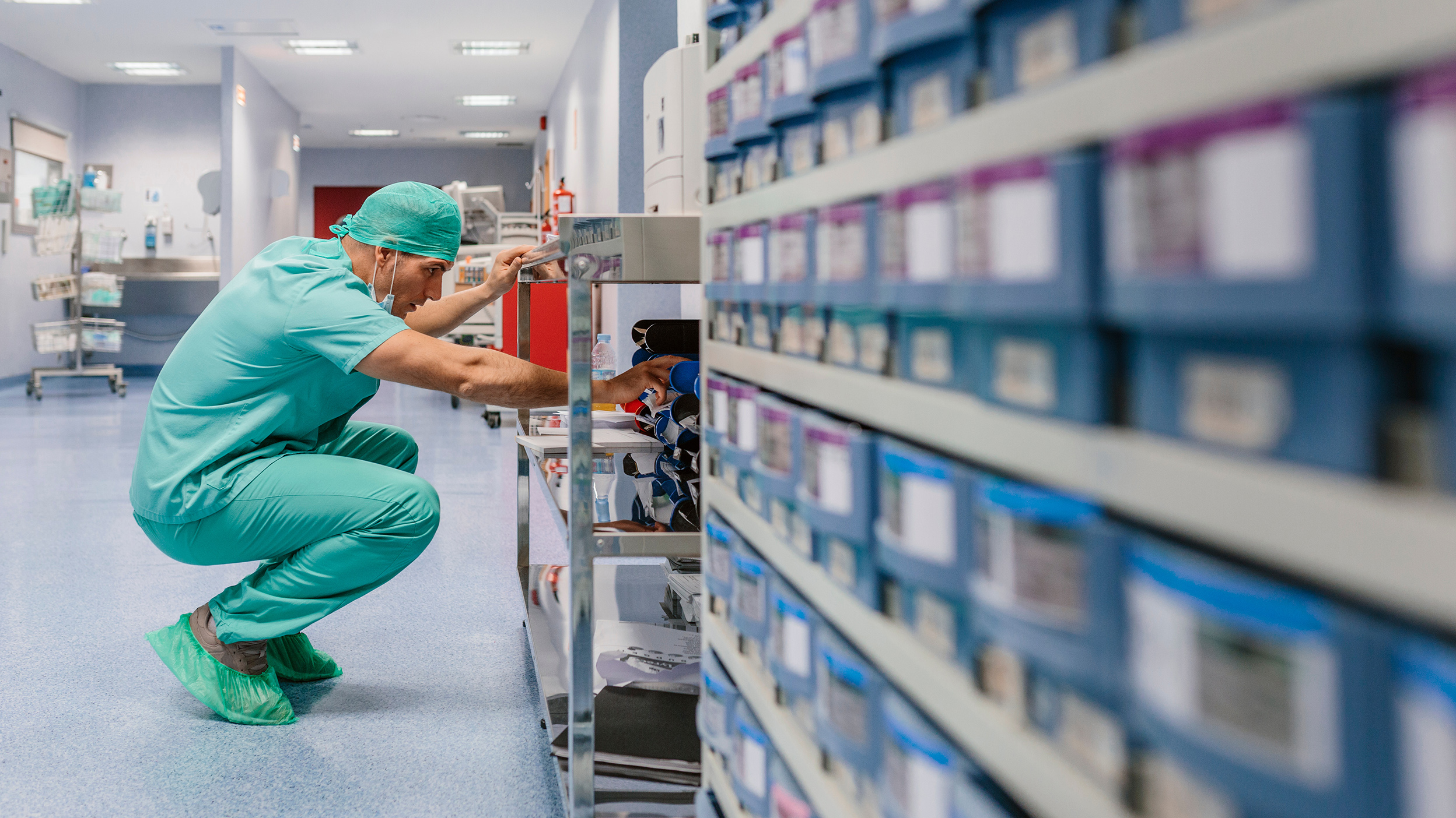 doctor looking in a medical aisle