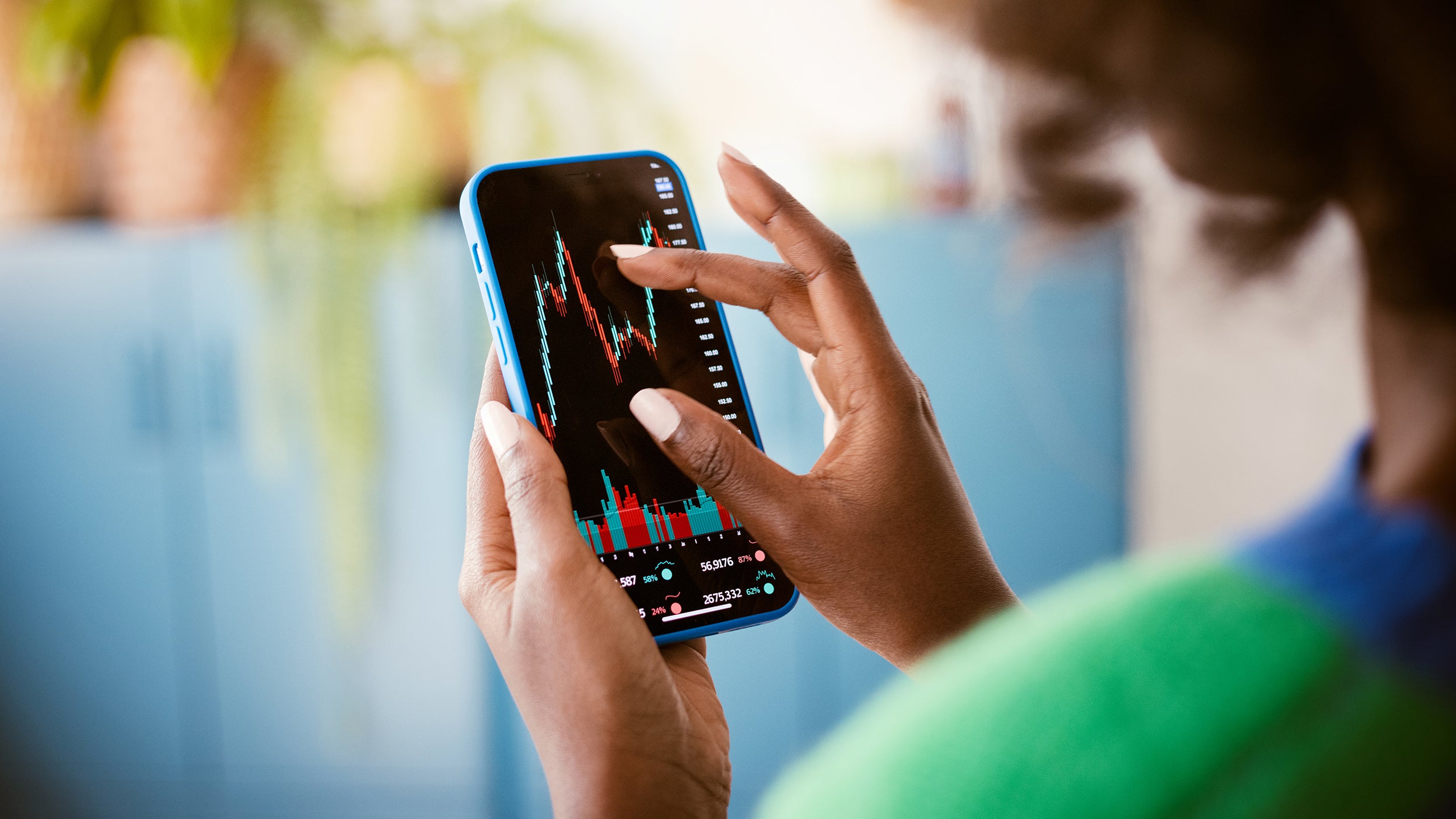 A person looks at a chart on their mobile device.