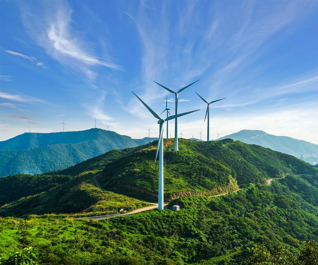 Wind turbines against blue sky