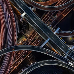 Aerial%20view%20of%20a%20busy%20highway%20interchange%20at%20night.