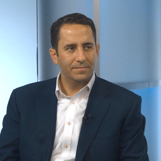 A%20person%20talking%20in%20a%20podcast%20show.