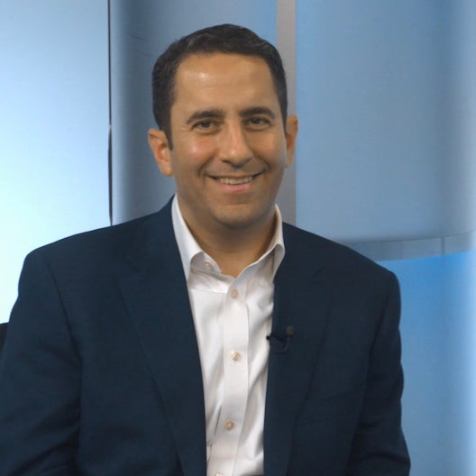 A%20person%20talking%20in%20a%20podcast%20show.