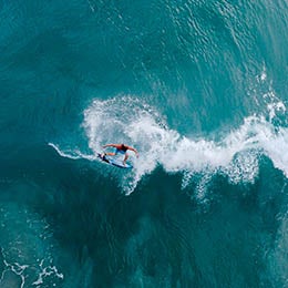Man%20big-wave%20surfing%20in%20bright%20blue%20water.