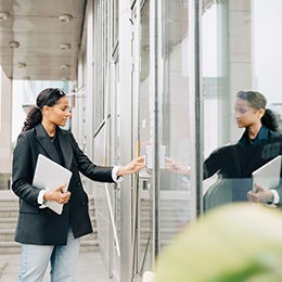 Businesswoman%20putting%20keycode%20to%20open%20office%20door
