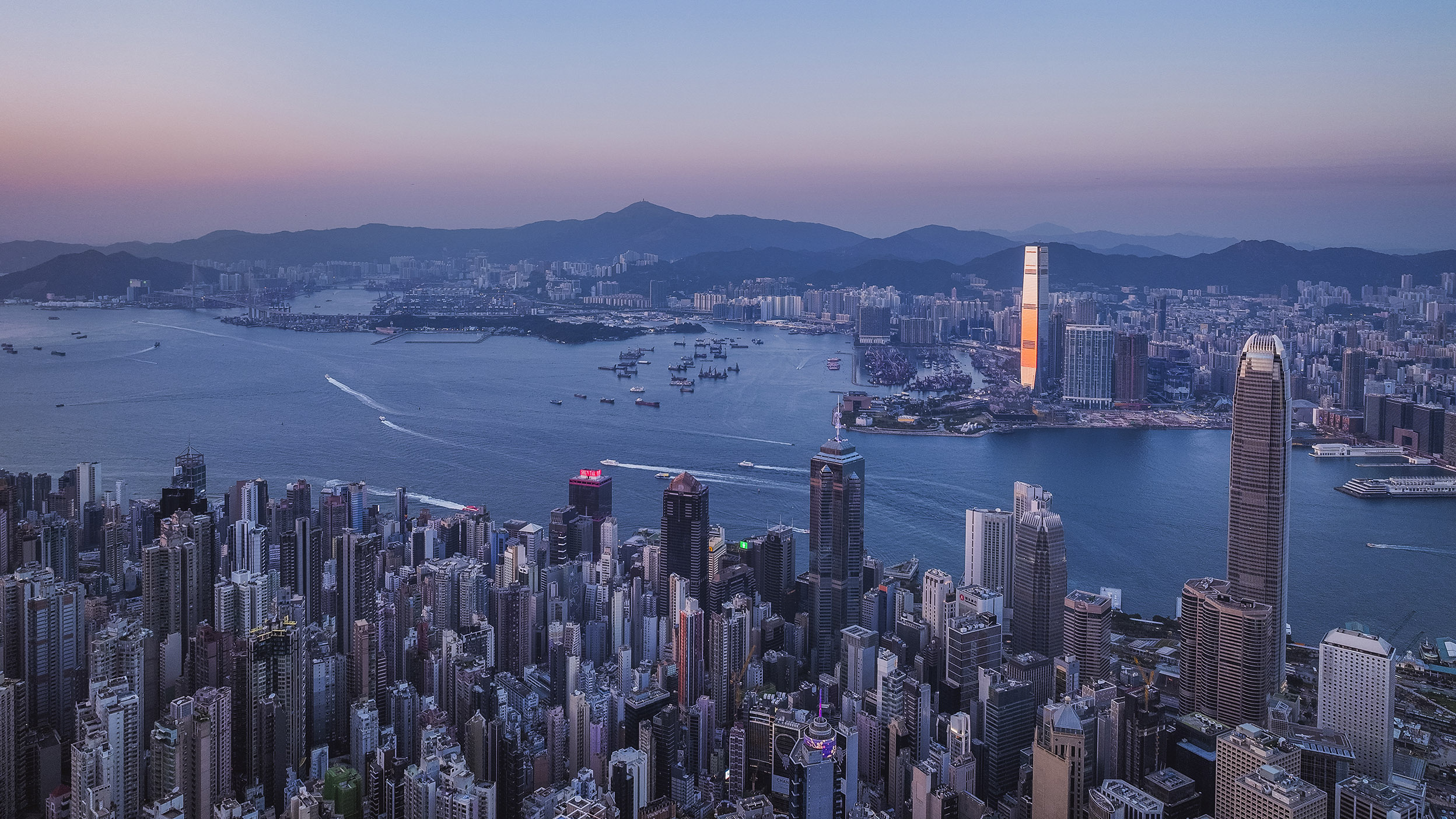 Hong Kong skyline over Victoria Harbour at sunset