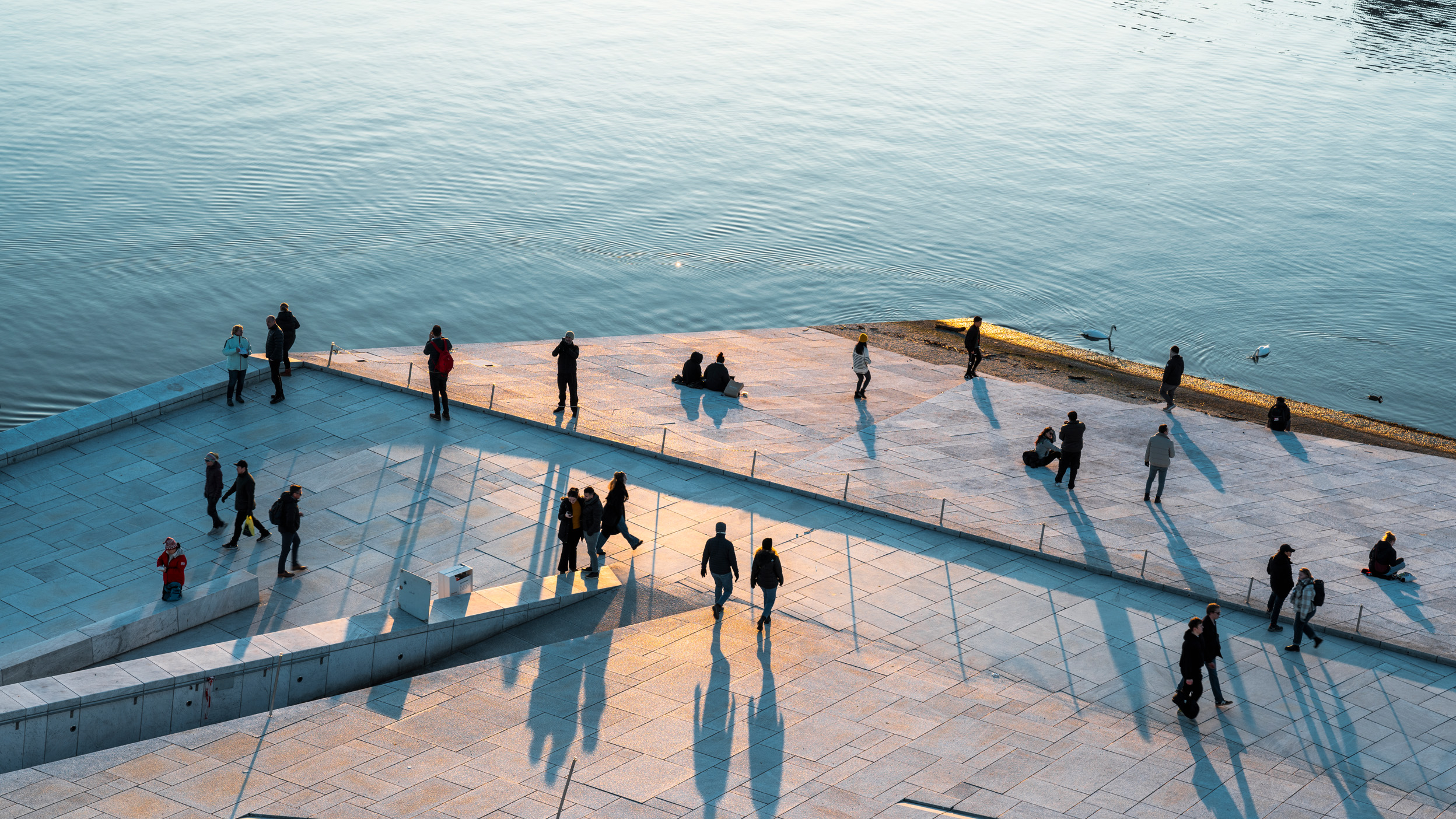 People walking along Oslo's harbour promenade, Oslo, Norway