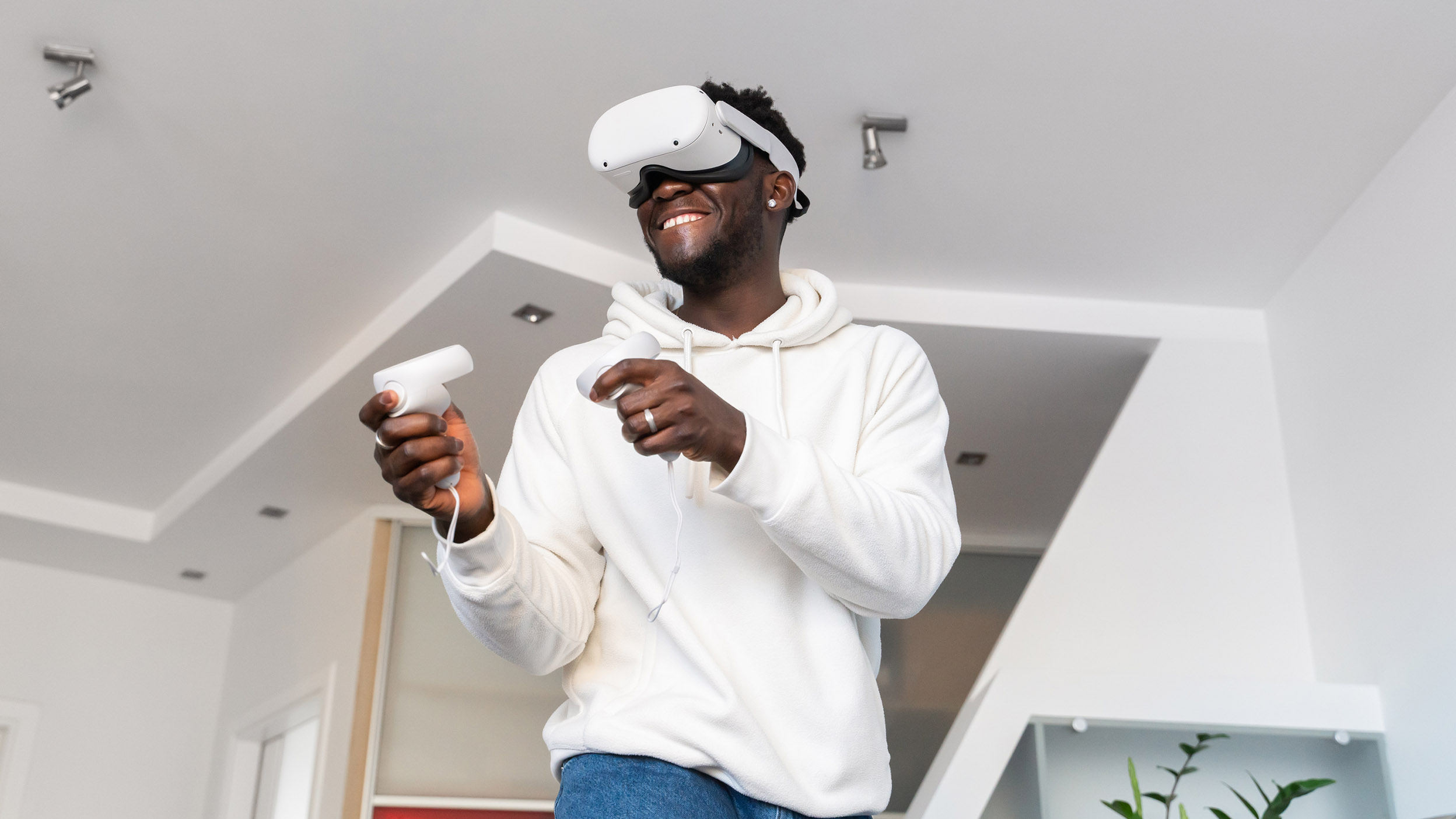 Person using a VR headset with controllers