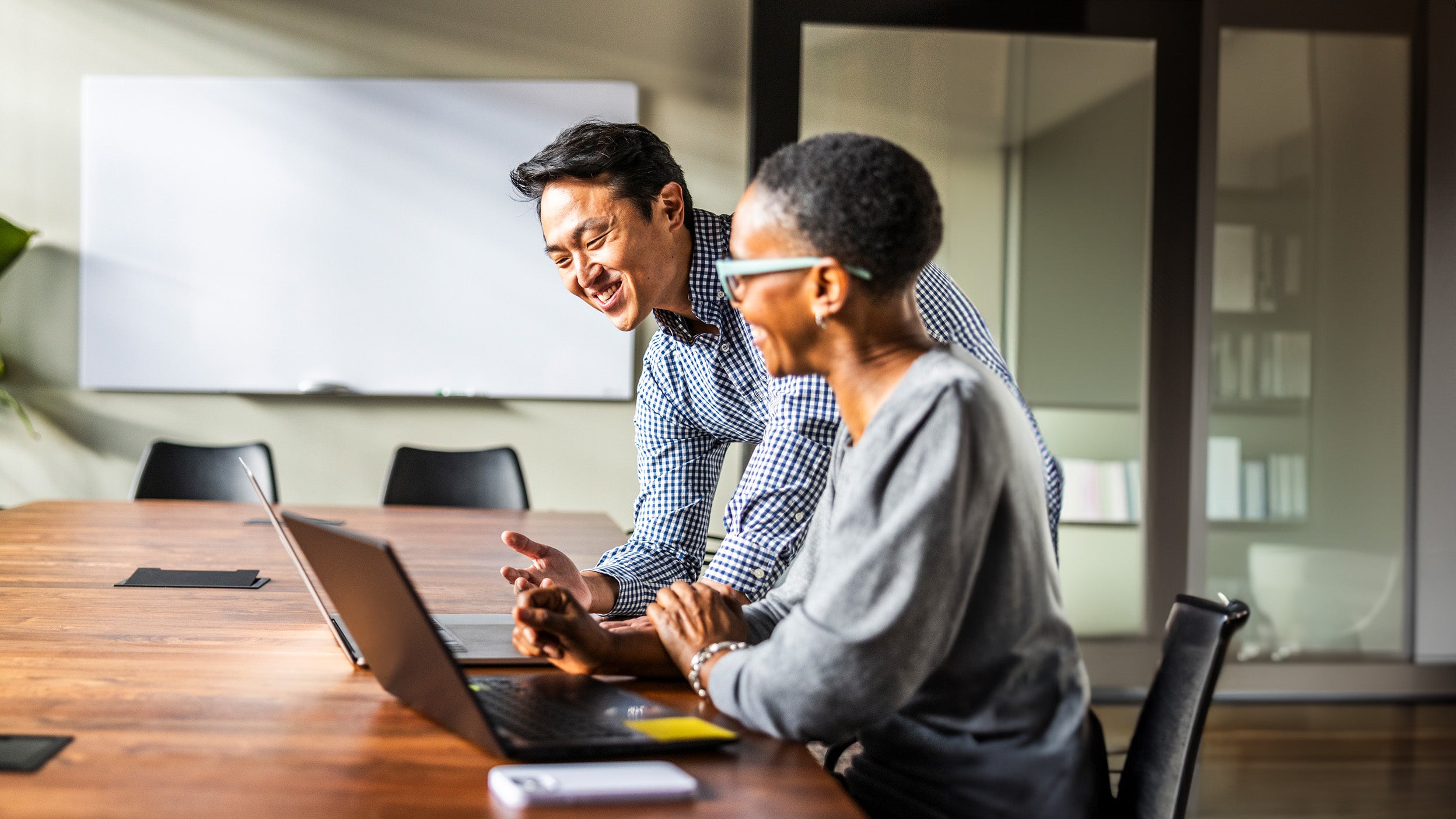 man and woman discussion paperwork