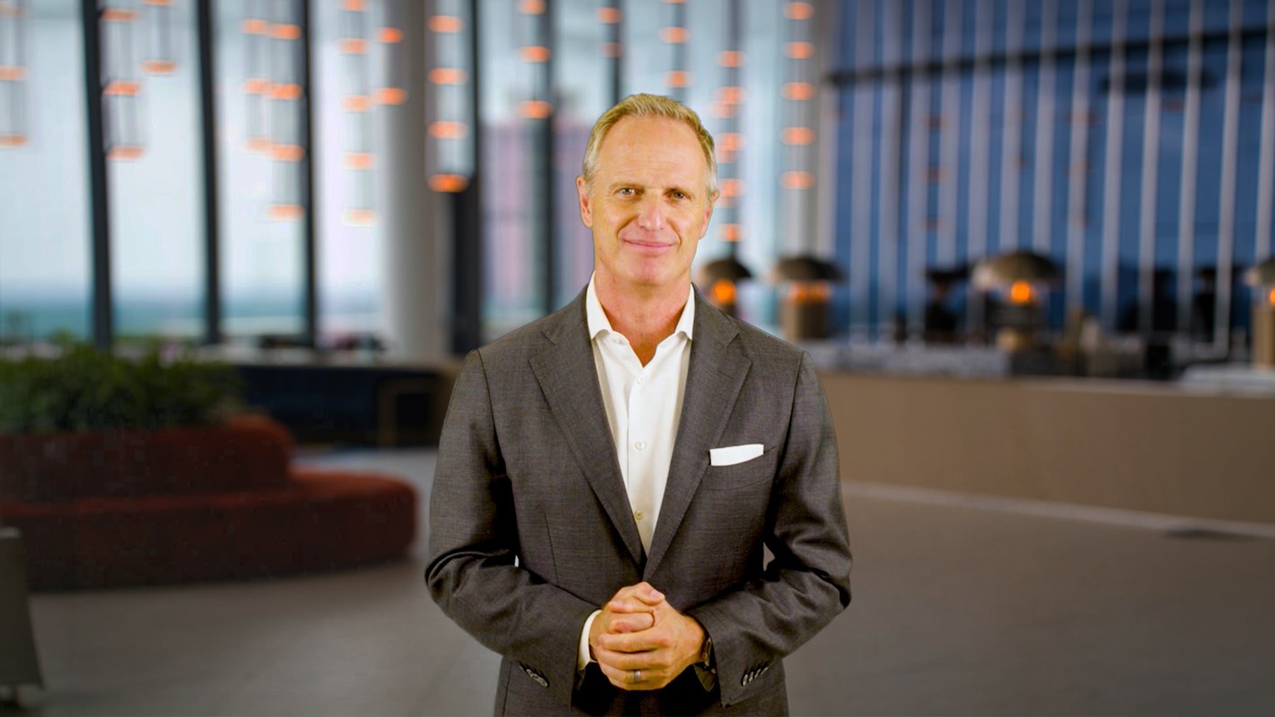 Jason Bloom standing in office lobby