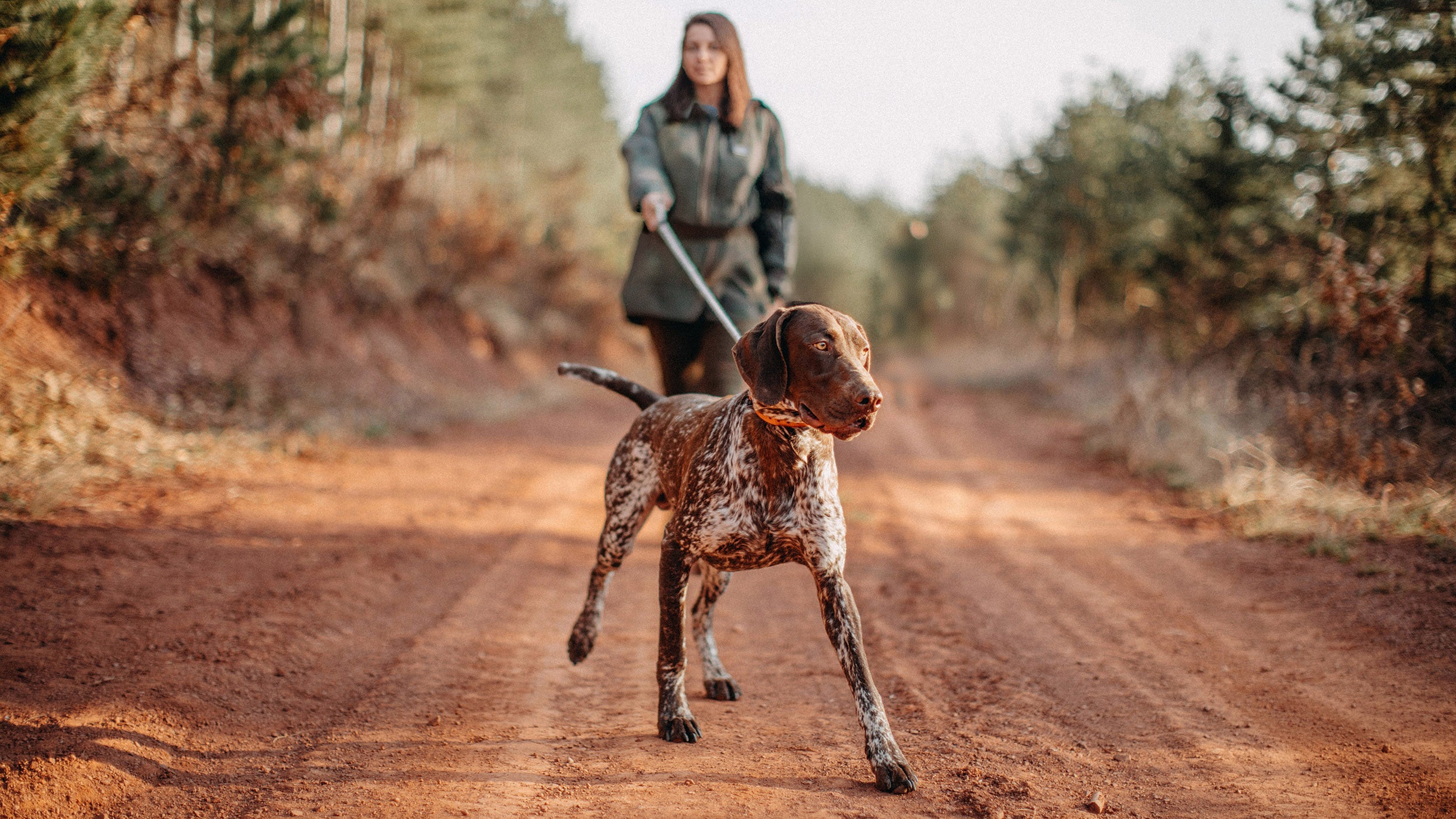 A women walking with dog