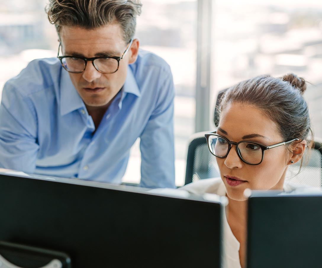 two people looking at a monitor