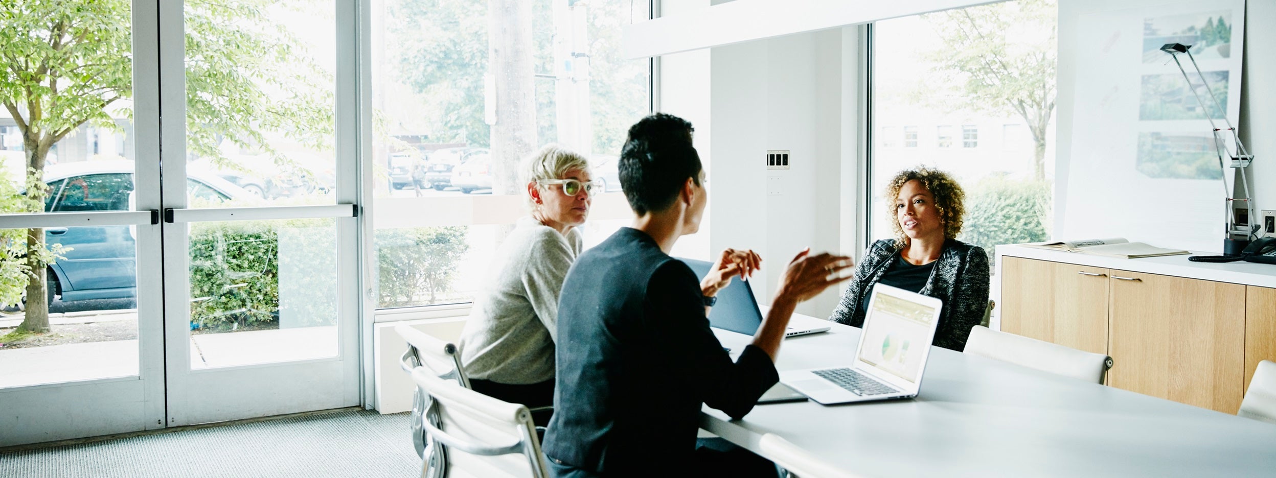 Three business women team members in a meeting collaboration 