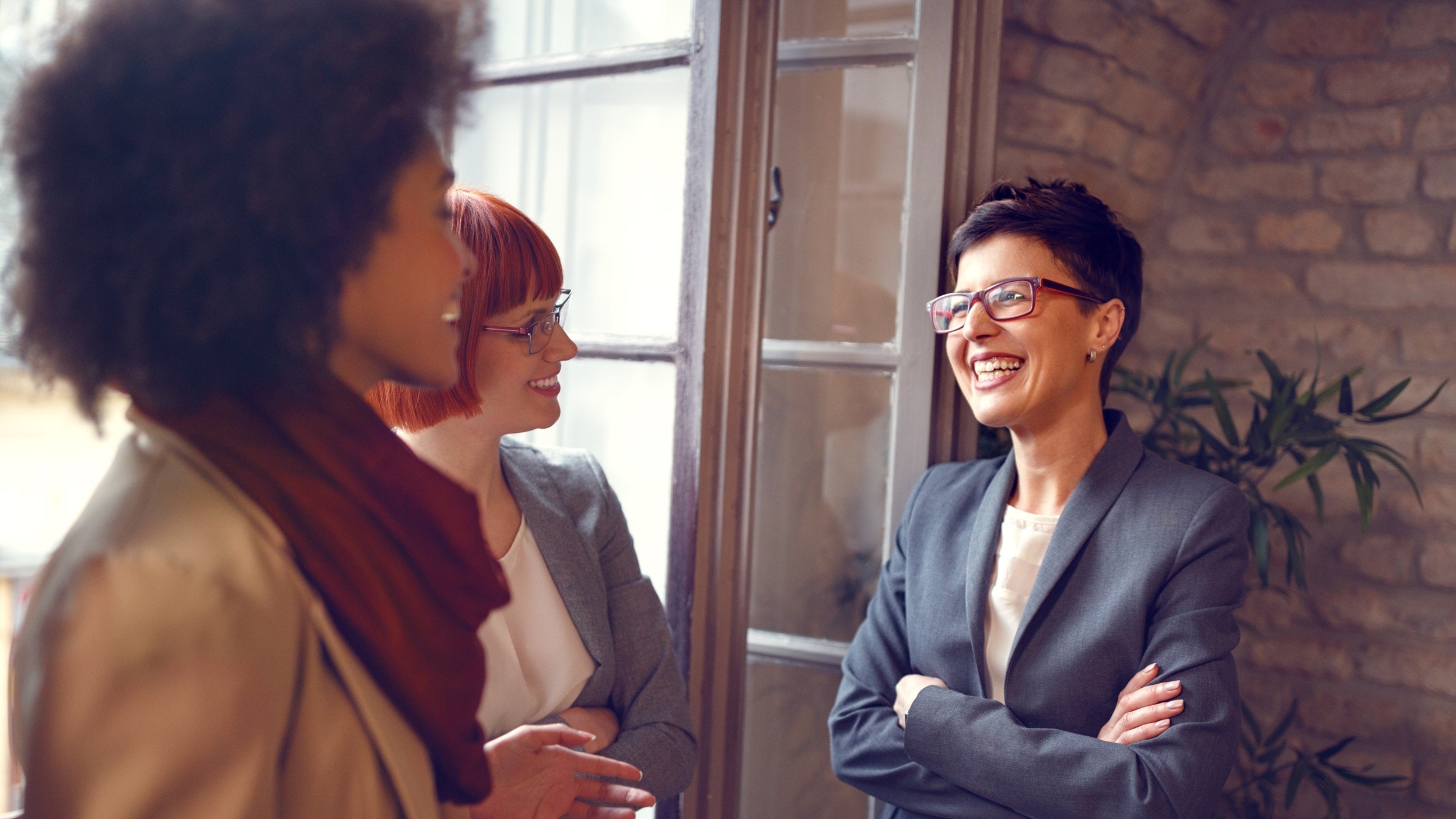 three business women talking