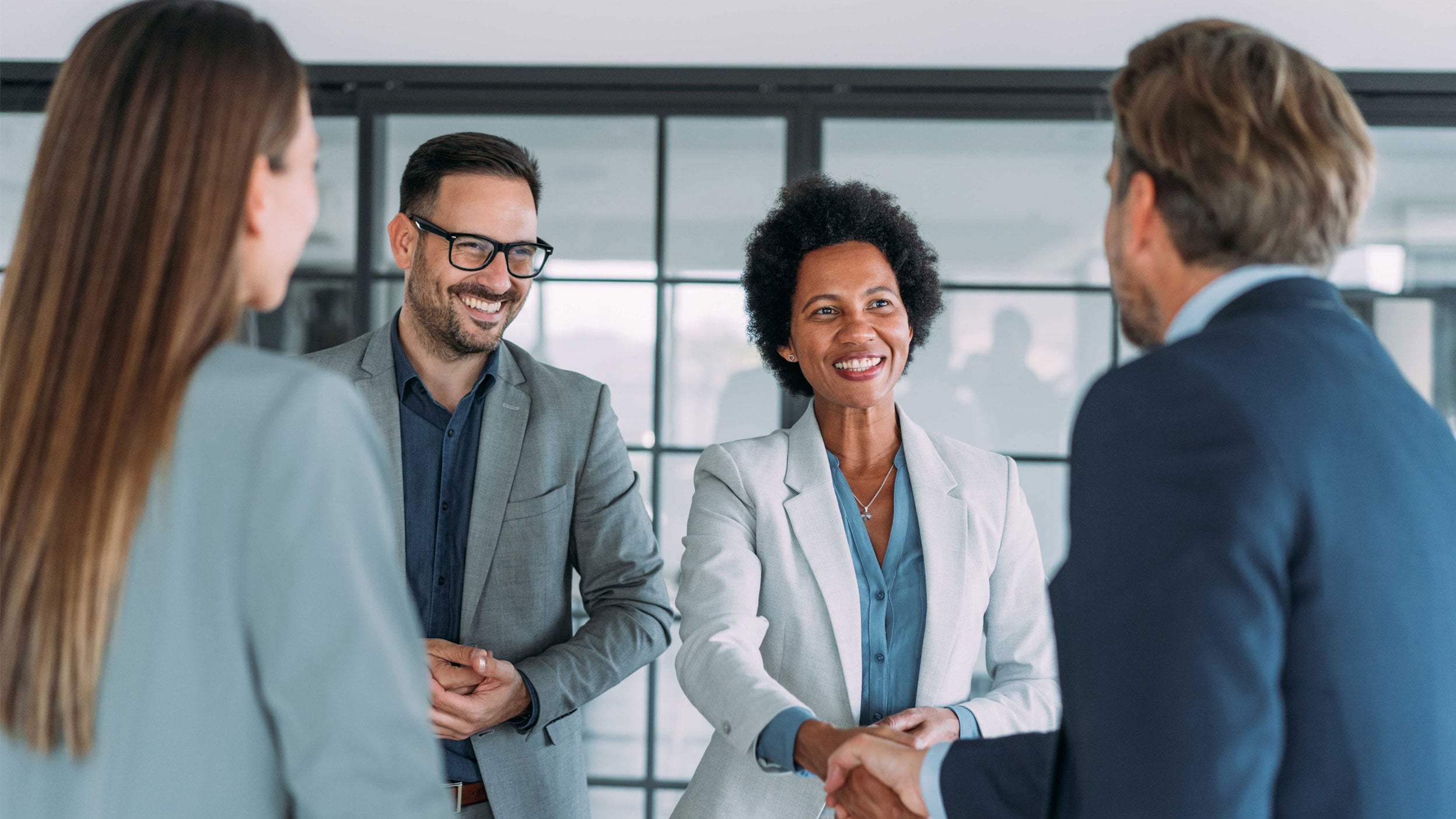 Four people in a meeting Room
