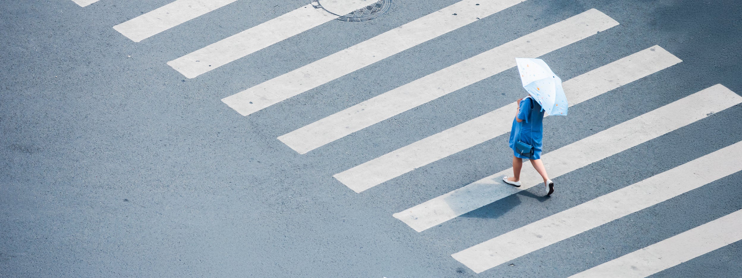 Women crossing road on zebra crossing
