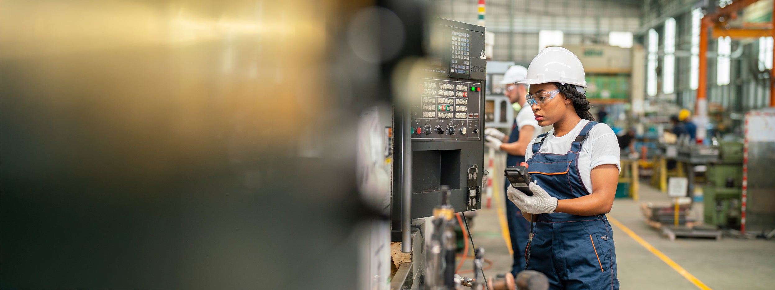 Woman inspecting at electronics factory