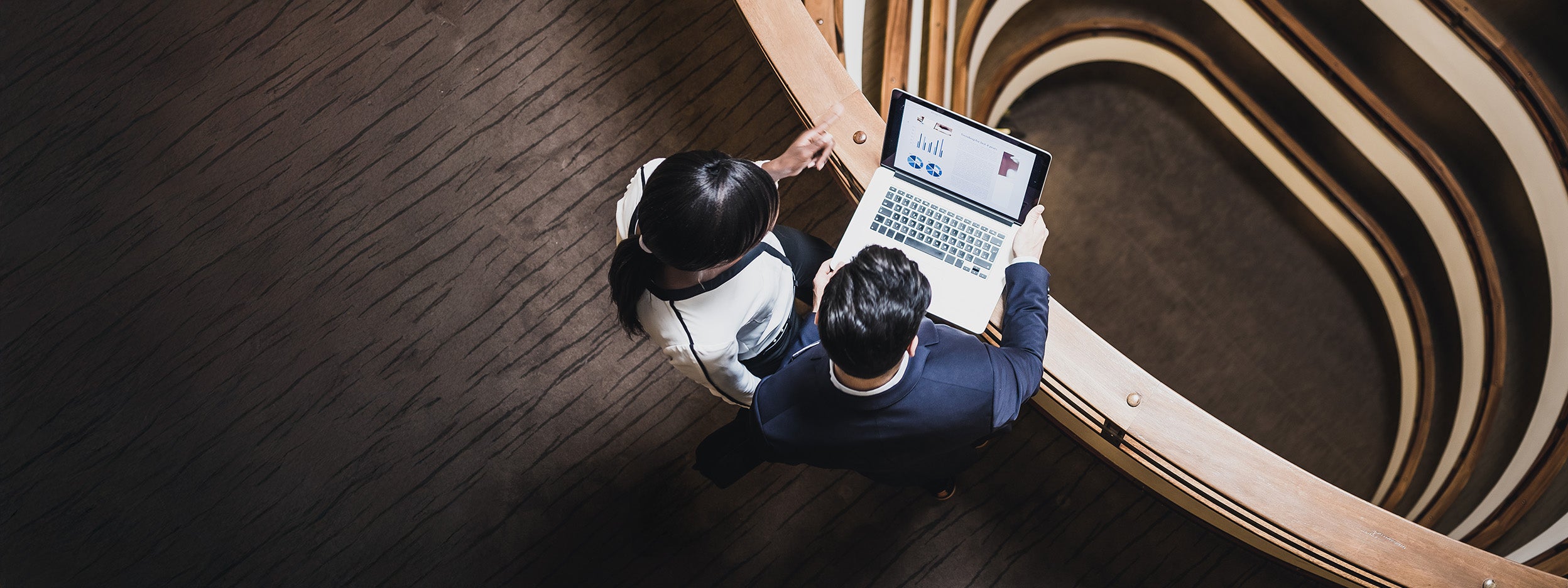 people walking down a hallway